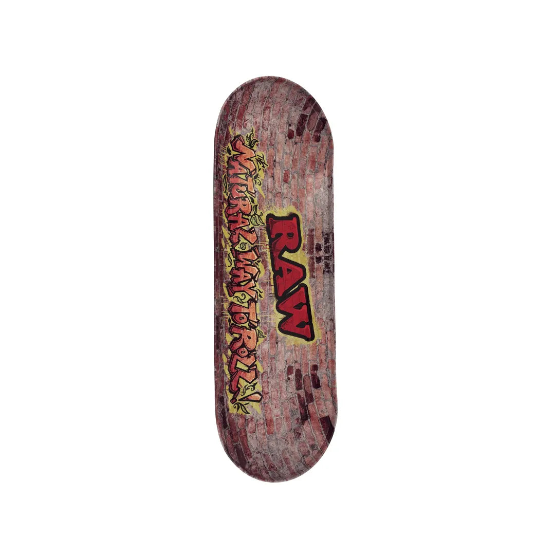 Plateau fumeur RAW design mur de briques avec lettrage graffiti « RAW Natural Way to Roll », en format allongé type skate pour accessoires CBD à Metz