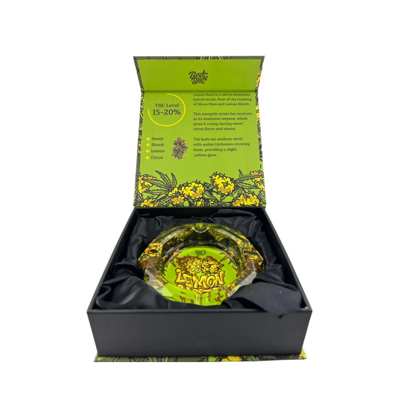 Cendrier Lemon Haze en verre présenté dans un coffret noir avec intérieur tissu, design décoratif vert et jaune, objet fumeur élégant
