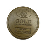 Grinder doré 4 parties avec logo The World Over et inscription GOLD, finition métallique mate, idéal pour accessoires CBD à Metz

