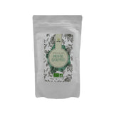 Sachet de thé vert bio au chanvre Menthe Lavande POP CBD, doypack blanc avec motifs botaniques violets et certification agriculture biologique
